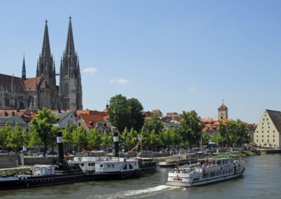 View at Danube river with tourist boats and cathedral