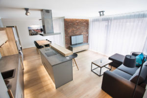 View at living room, bar & kitchen 2-bedroom apartment