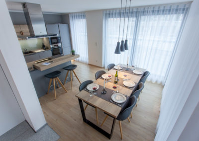 Dining table and kitchen of 2-bedroom apartment