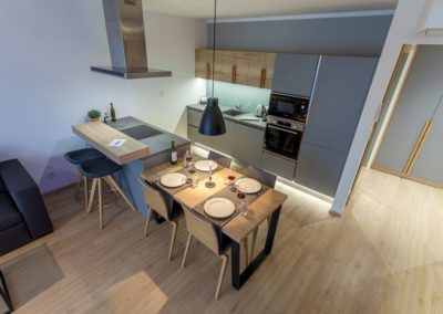 View at dining table and kitchen of 1-bedroom apartment (2-room)