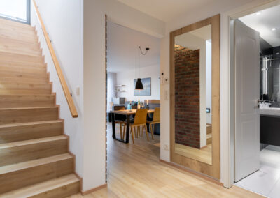 Hallway with view to living room and stairs to rooftop terrace - 2-bedroom apartment