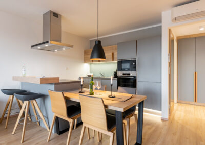 View to dining table and kitchen - 1-bedroom apartment